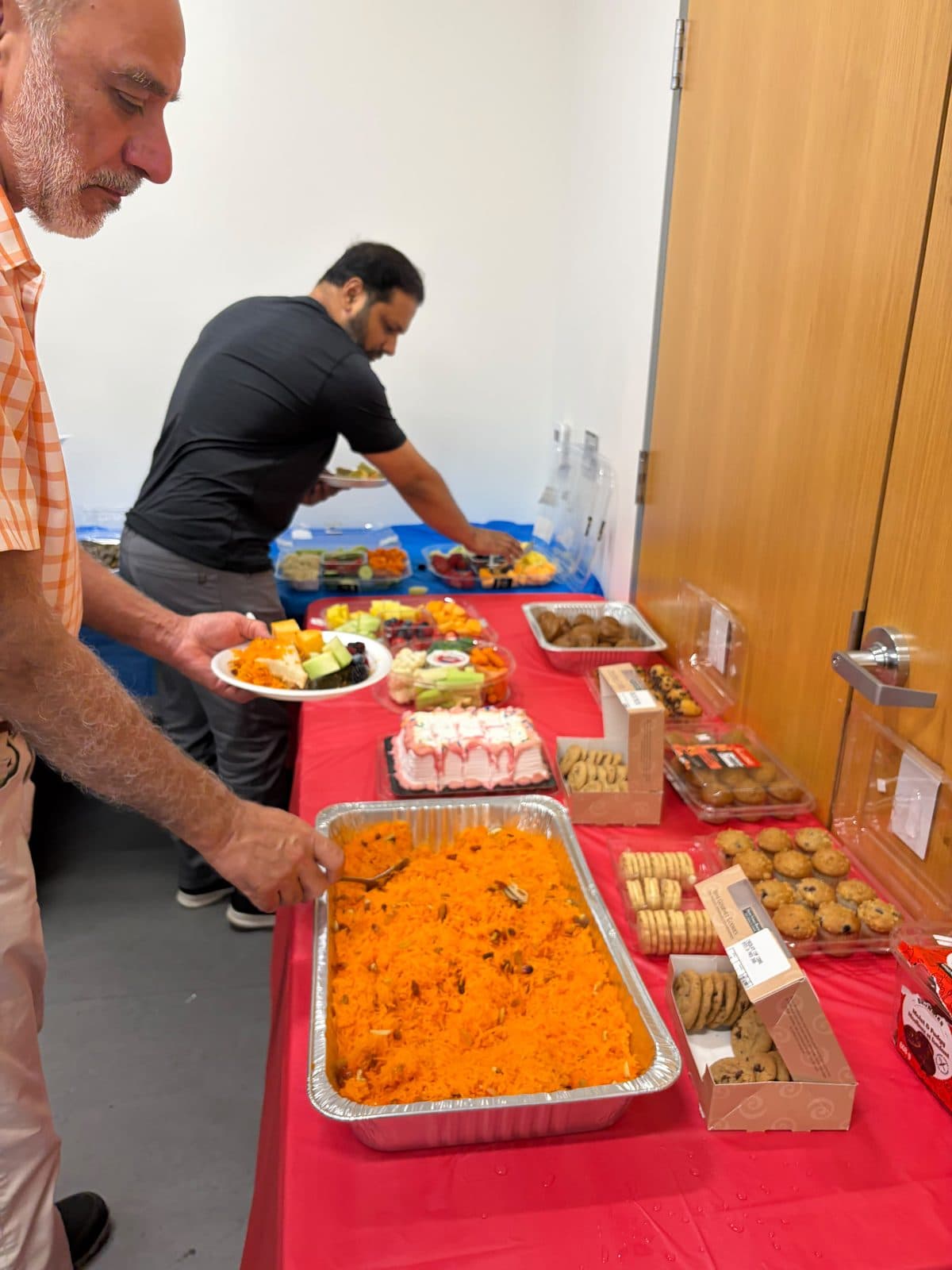 Guests help themselves at the shared buffet